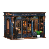 DIY mini dollhouse kit, dark blue storefront facade with gold details and display windows.