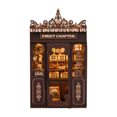 Mini shop dollhouse kit, front view with ornate canopy and lit display counters