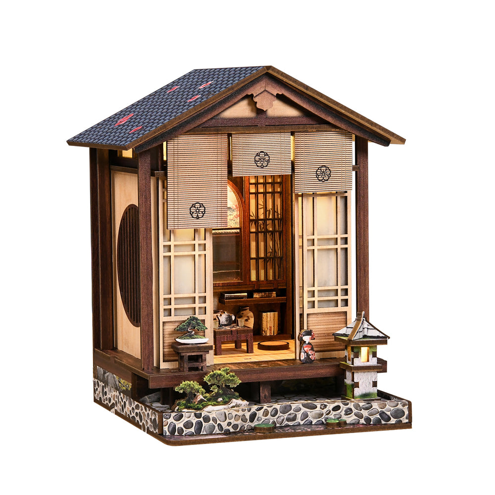 Wooden mini book nook house with open front, glowing interior, and lantern details