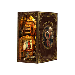 DIY book nook kit featuring a lit miniature room scene with decorative doorway