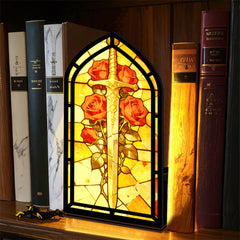 Stained-glass arched book nook with sword and red roses, black frame on shelf