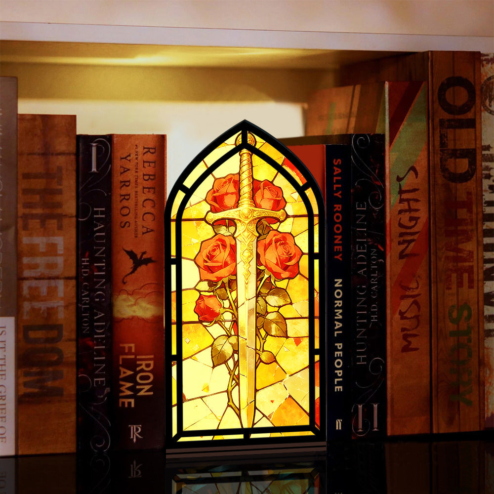 Stained-glass book nook panel with sword and red roses, black arched frame