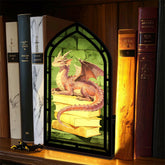 Dragon book nooks display: black arched frame with dragon and stacked books inside