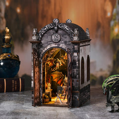 Miniature dragon booknook house with open arched entrance and warm-lit interior