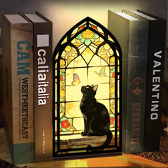 Stained glass arched book nook with black cat silhouette and butterfly window glow
