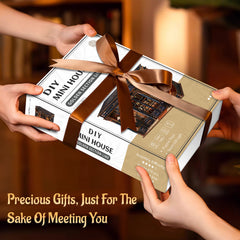 DIY mini dollhouse kit gift box held with brown ribbon bow.