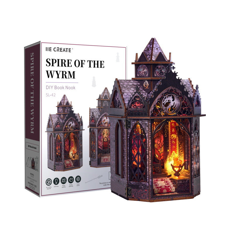 Wooden fantasy mini tower kit with lit interior, arched windows, and spire roof