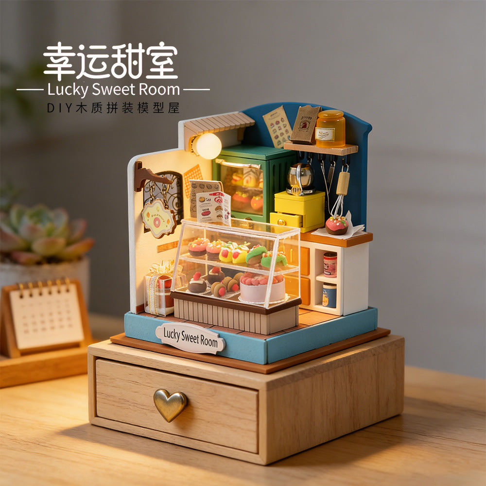 Miniature wooden sweet shop craft kit with built-in lights and dessert display counter