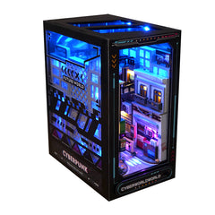 Cyberpunk city book nook kit box showing side views of a blue-lit miniature street