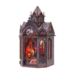 Angled view of a wooden fantasy miniature tower with glowing interior and arched front