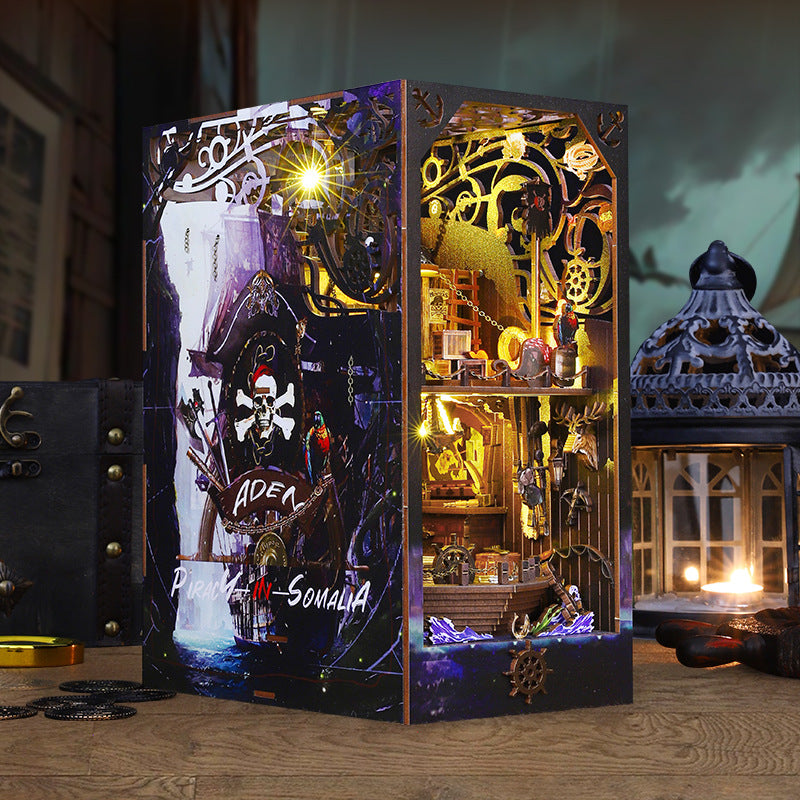 Pirate DIY book nook kit box with illuminated mini ship bookshelf diorama, gold and blue