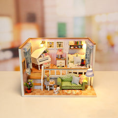 Miniature dollhouse room kit with green sofa, kitchen counter, bed, and lit floor lamp