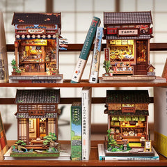 Miniature wooden book nook building set, multiple detailed storefronts shown from different angles