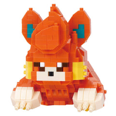 A colorful, pixelated toy resembling a character from a video game, made up of small orange and yellow blocks.