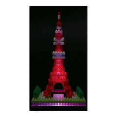 A colorful, illuminated Lego tower stands against a dark background.