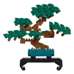 A Lego tree with green leaves and brown branches, standing on a black base.