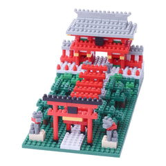 A colorful toy model of a Japanese-style temple made of building blocks, featuring red and green colors and intricate details.