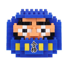A pixelated image of a character made up of blue and yellow blocks, with a small Japanese character on the bottom right.
