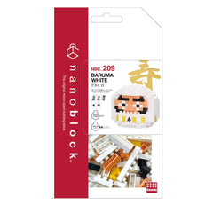 The image is a packaging for a product called "DARUMA WHITE" from the "nano block" brand. It features a close-up of the product itself, which is a small white block with a face on it, along with a variety of colorful building blocks. The packaging has a red and white color scheme, and the product is described as a "150-piece" set.