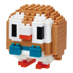 A pixelated toy resembling a small owl or penguin made of building blocks in various colors.
