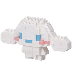 A white, pixelated character made of small white blocks, resembling a pixelated doll or a pixelated animal.