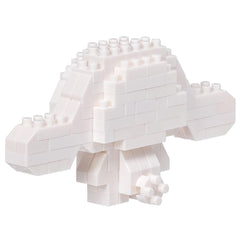 A white, three-dimensional object composed of numerous small white blocks, resembling a geometric or abstract structure.