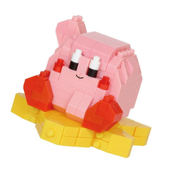 A pink and yellow toy figure made of small building blocks, with a smiling expression.