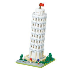 A small, white, brick-like tower with a flag on top, resembling a miniature version of the Leaning Tower of Pisa.