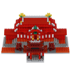 A 3D model of a red and white building made of red and white building blocks, with yellow and green accents.