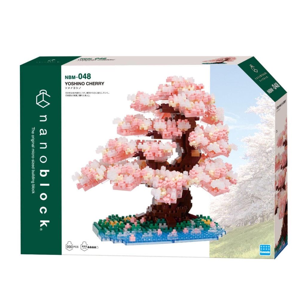 The image is a box for a Nanoblock Yoshino Cherry building set. The box features a close-up of a pink cherry blossom tree made of building blocks, showcasing the product's design.