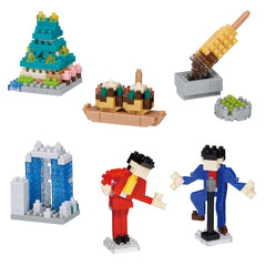 a collection of seven different objects, including a pyramid-shaped structure, a cupcake-shaped structure, a popsicle stick structure, a miniature model of a building, two figures, and a popsicle stick structure.