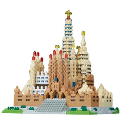 A detailed 3D model of a castle-like structure made of small, colorful building blocks, resembling a Lego or similar toy.