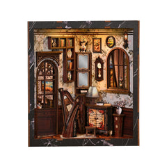 Miniature musical instrument display box with arched window, lamp, and small cabinet, front view