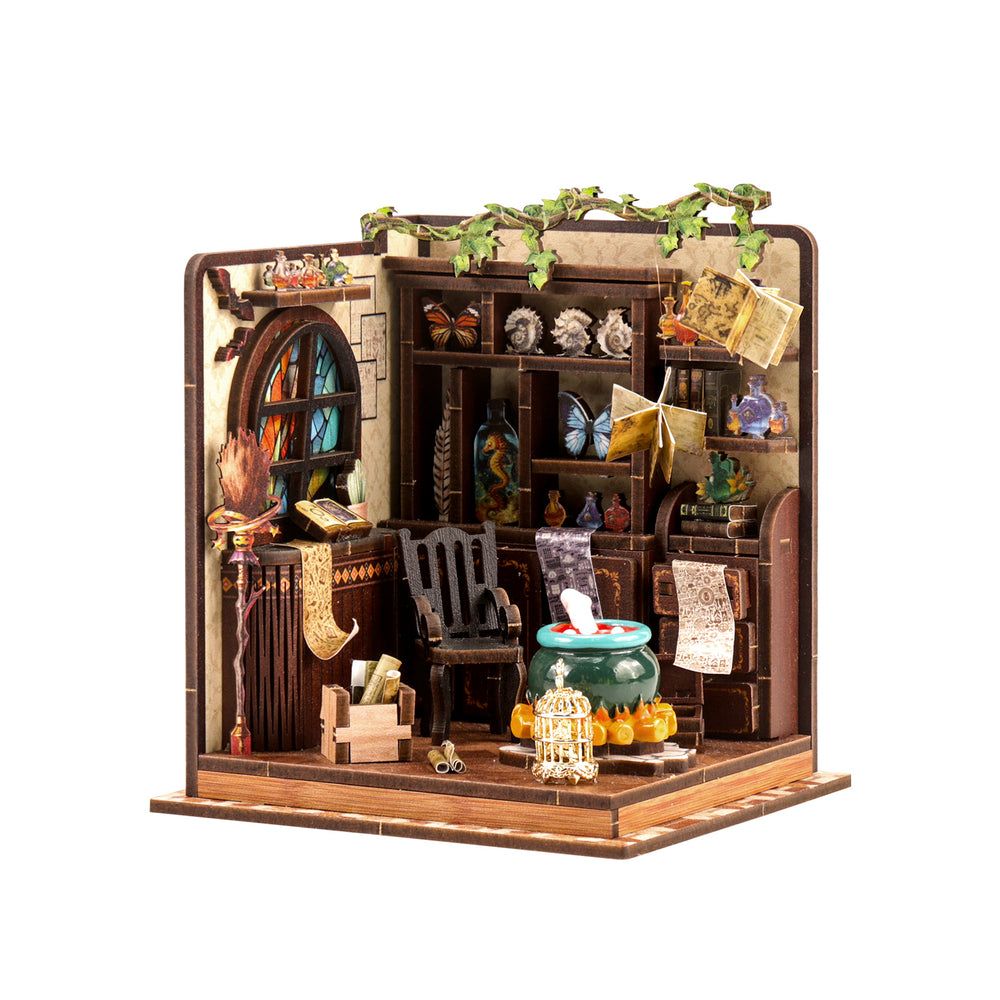DIY miniature house kit showing open-front room with shelves, window, fireplace, and furniture