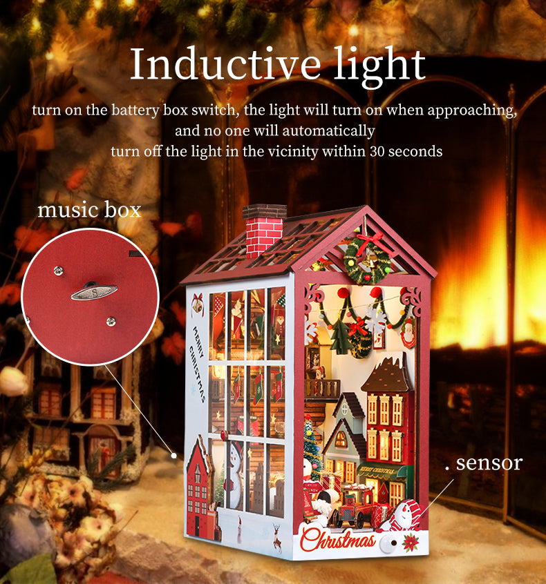Red miniature Christmas book nook shelf insert with sensor light and festive decorations on display