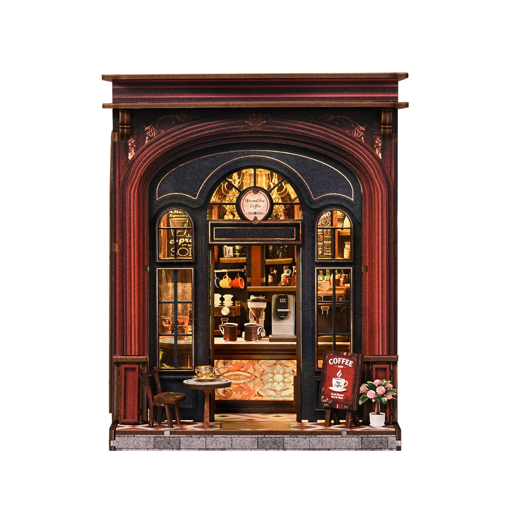 DIY book nook coffee shop miniature showing front shelves, counter, and small chairs