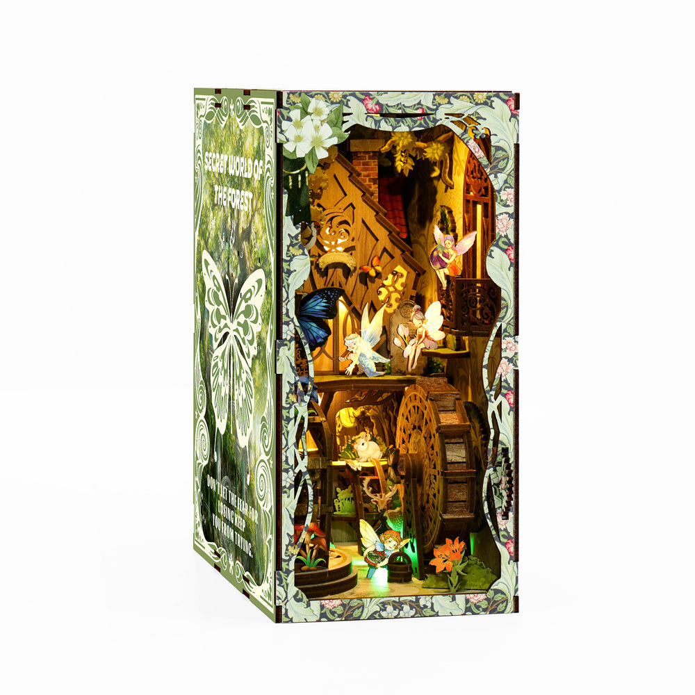 DIY book nook kit in illustrated forest-themed box with open display window and lights