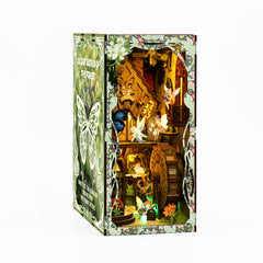 DIY book nook kit in illustrated forest-themed box with open display window and lights