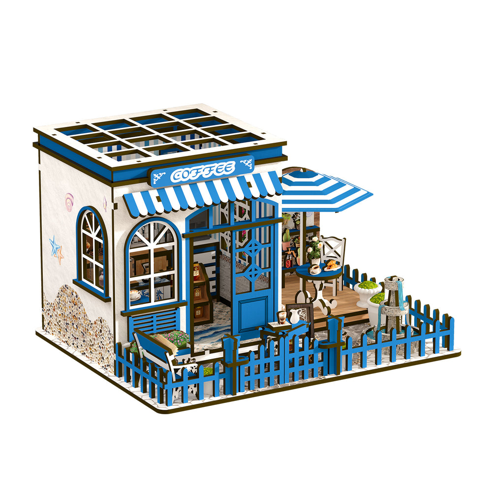 DIY miniature coffee shop house with courtyard, blue accents, striped canopy and outdoor tables