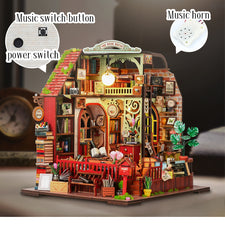 Miniature dollhouse interior with bookcases, arched doorway, and potted plants on the base