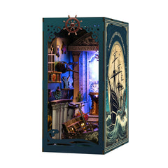 DIY ocean book nook kit box showing glowing miniature underwater interior through window