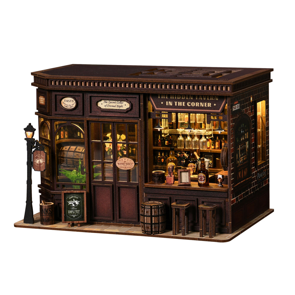 Miniature corner tavern with lit interior bar, bottles, and front door windows