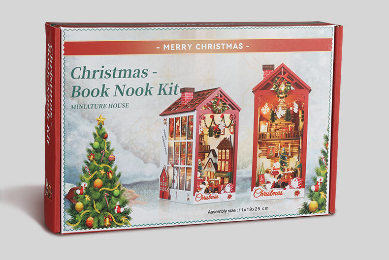Christmas book nook kit box showing a red miniature house shelf insert with lights and decorations