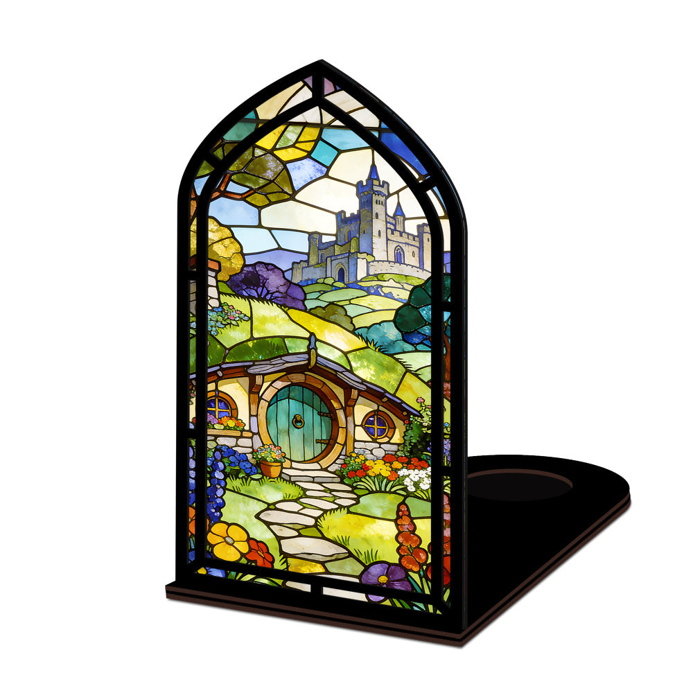 Book nook display with stained-glass style panel and black base, no candle visible