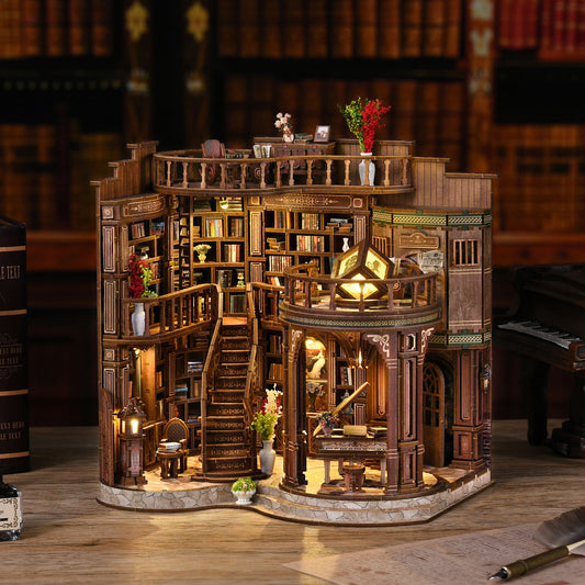 A miniature model of a library with a bookshelf, a piano, and a balcony, all intricately designed and illuminated.
