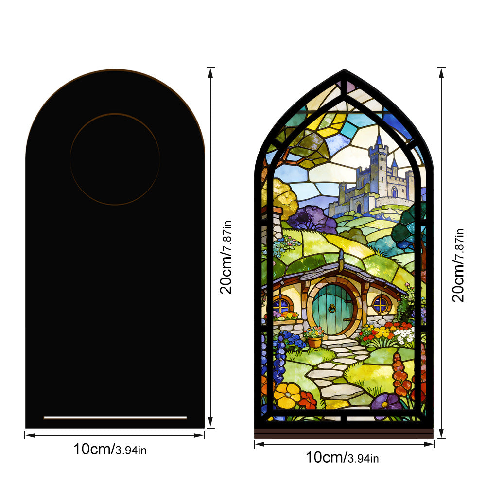 Arched book nook display with stained-glass style village scene