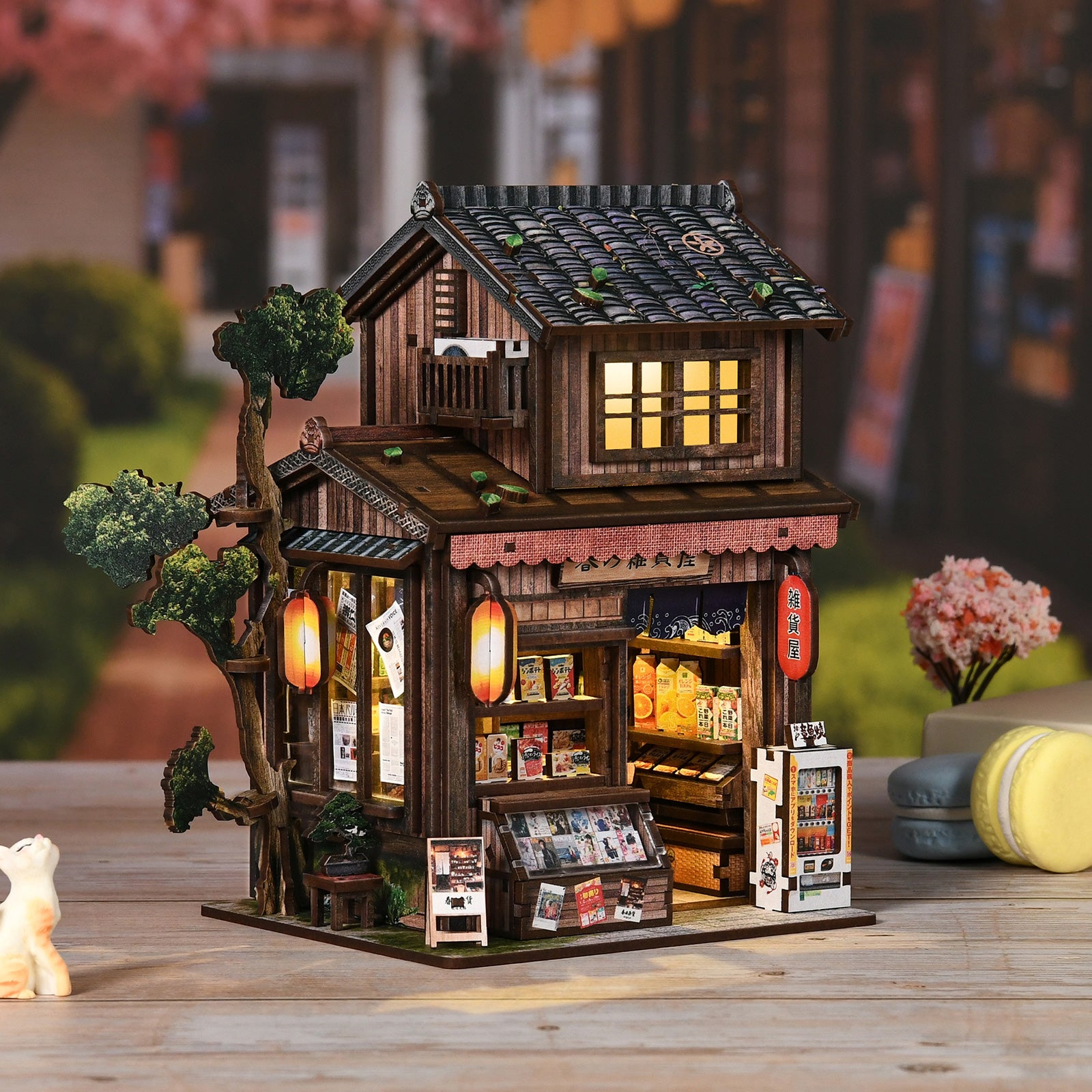 Illuminated miniature wooden grocery store with tiled roof and open front display shelves