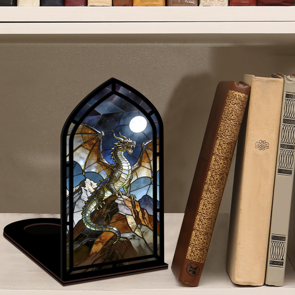 Arched stained-glass dragon stand with black frame on a tabletop
