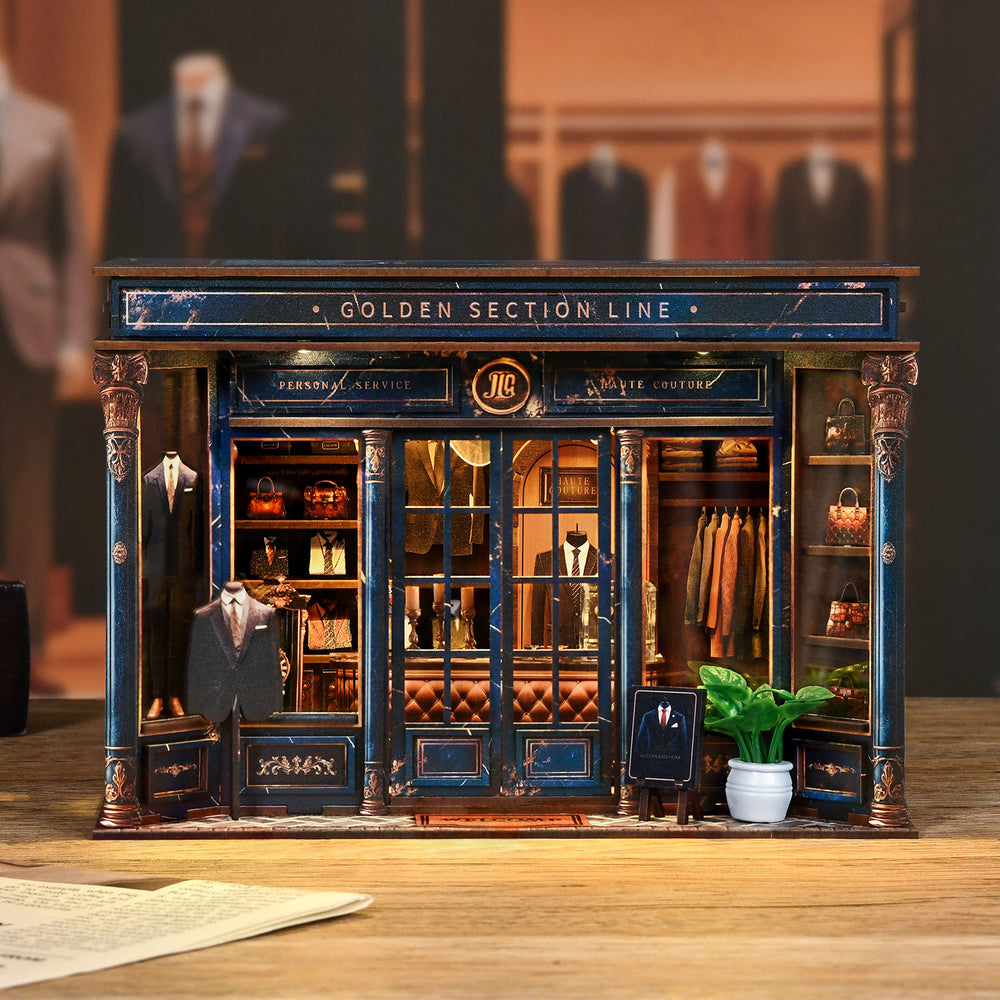 DIY mini dollhouse kit, front view dark blue storefront with clothing and shop display pieces.