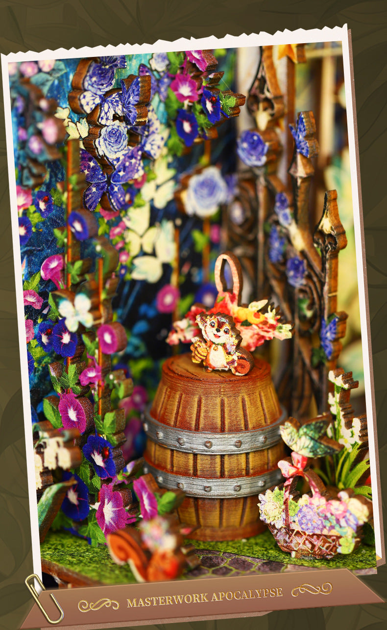 Miniature fairy garden book nook scene with blue flowers, rabbit, and glowing lights